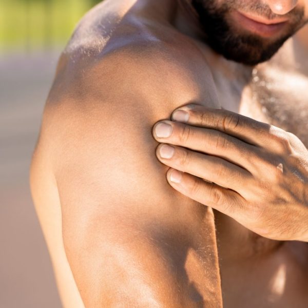 Man massaging his shoulder